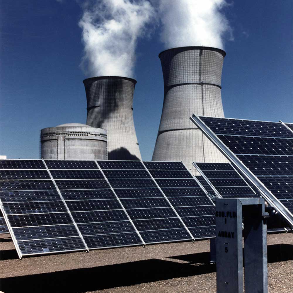 Solar technician commissioning a battery-ready inverter